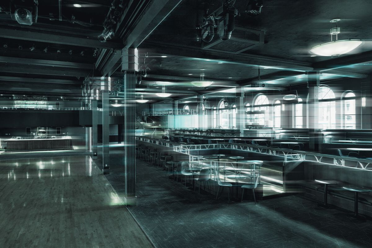 The edge of the sprung dance floor, the columns and the seating tiers