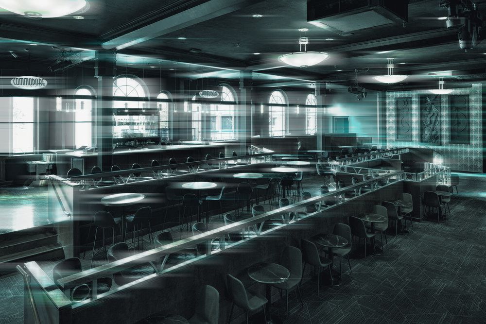 The upper bar and tables under the arched windows